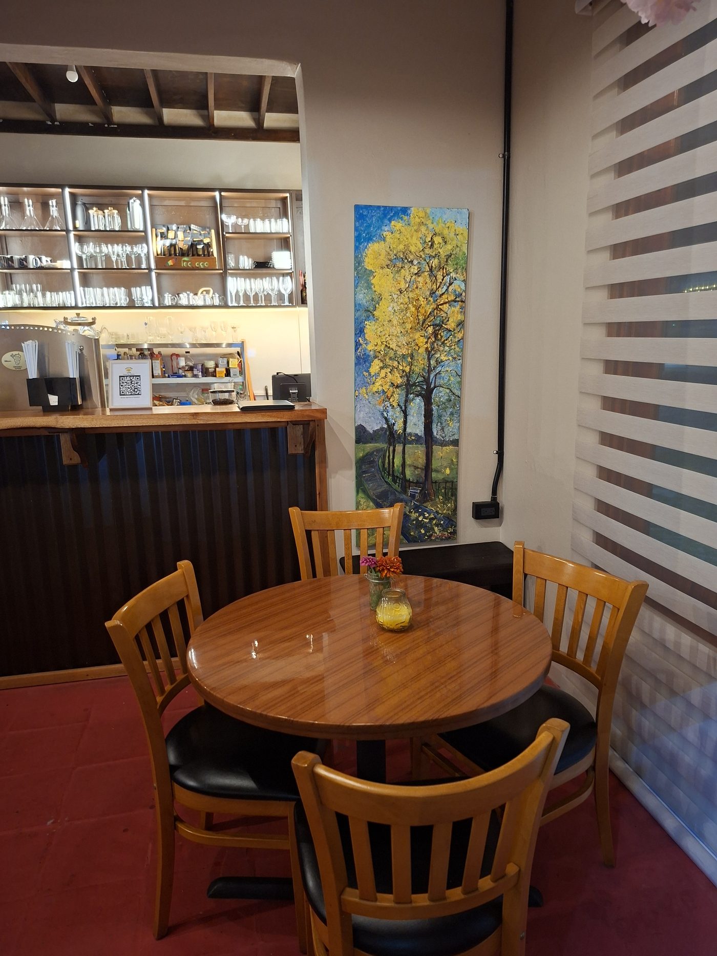 The bar and lounge corner at Poui Tree Café